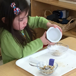little girl pouring